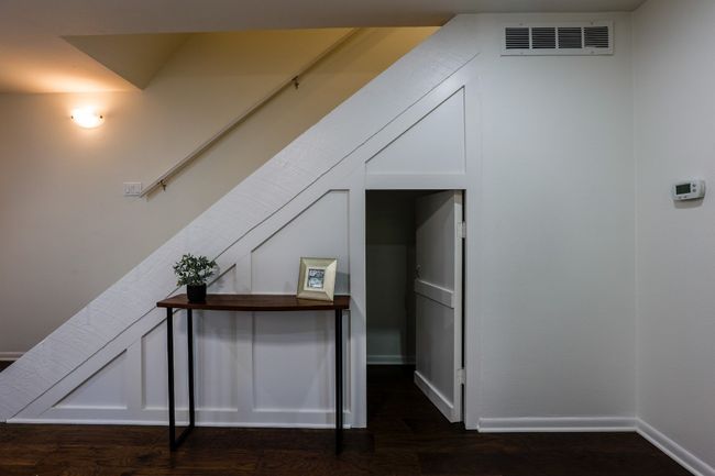 Under the stairs storage. | Image 32