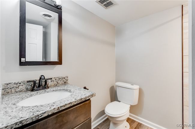 Bathroom with vanity and wood finished floors | Image 21