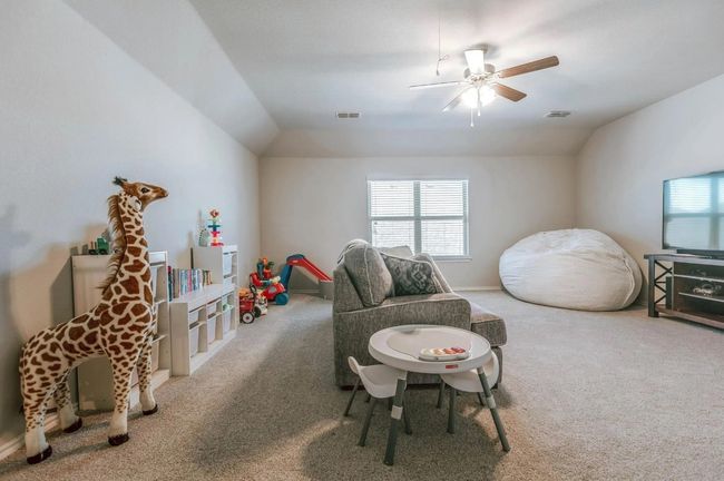 Rec room with visible vents, vaulted ceiling, and carpet flooring | Image 29
