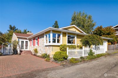 Charming Tacoma cottage on the desirable West Slope. There is so much to love about this home including partial water views, vaulted ceilings, hardwood floors, and bonus 462 sq ft finished attic space. | Image 1