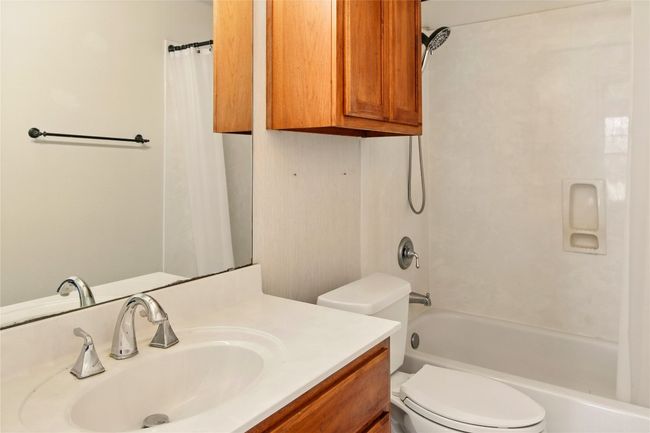 Full bath with shower / bath combination with curtain, toilet, and vanity | Image 16
