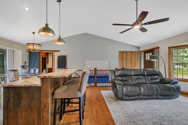 View looking at front door and stairway leading to lower level | Image 5