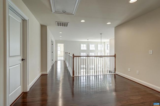 Hardwood floors in the second floor hallway overlooking the great room. | Image 32