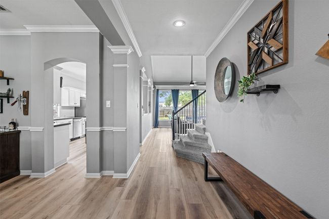 Hallway with arched walkways, & ornamental molding | Image 4