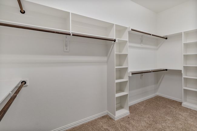 Spacious closet with carpet floors | Image 18