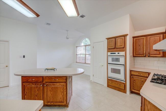 Lots of storage to include island | Image 11