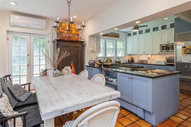 Dining area is open to kitchen offering convenience and company for the chef! | Image 11