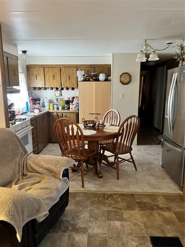 Dining space with stone finish flooring | Image 25