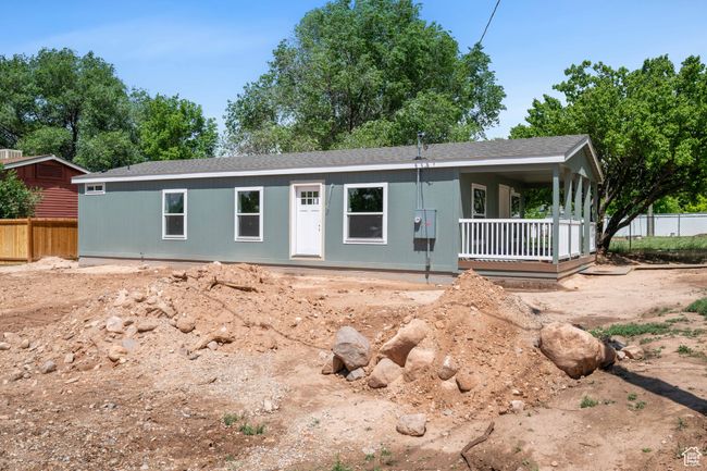 View of front of house with a shingled roof and a porch | Image 22