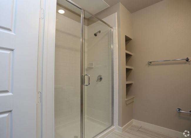Bathroom with a shower with door and wood-type flooring | Image 5
