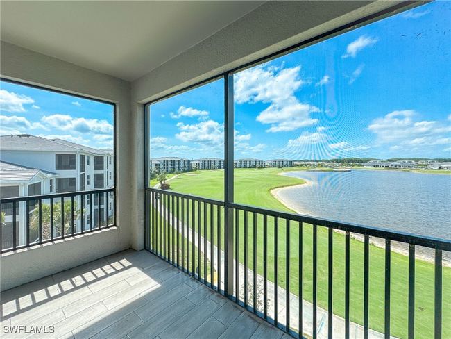 Unfurnished sunroom with a water view | Image 16