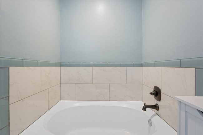 Full bath with a bath and vanity | Image 26