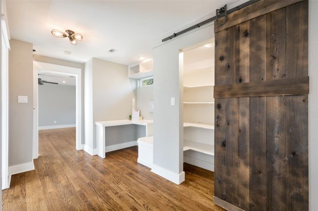 Walk in Pantry with sliding barn door and a built-in work/craft space | Image 15