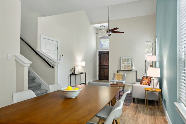 The dining area flows effortlessly into the living room, creating an open and inviting space that encourages easy conversation and a natural flow for gatherings or everyday living | Image 11