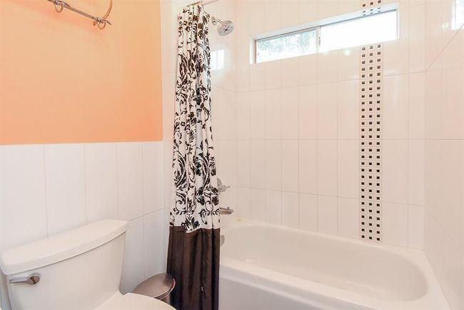 The combination shower and tub is bright and fun, with the perfect amount of detail. | Image 42
