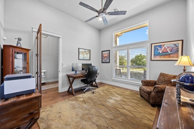 Home Office/Study featuring elegant French doors is an ideal space for remote work or study | Image 6
