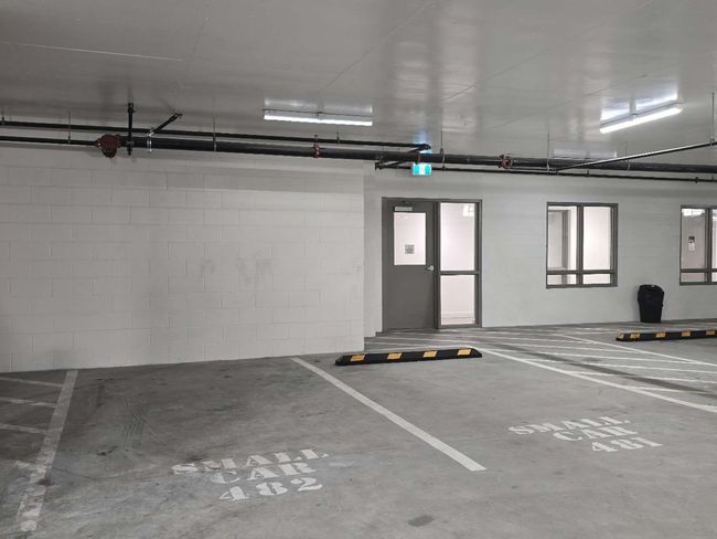Parking garage featuring concrete block wall | Image 28