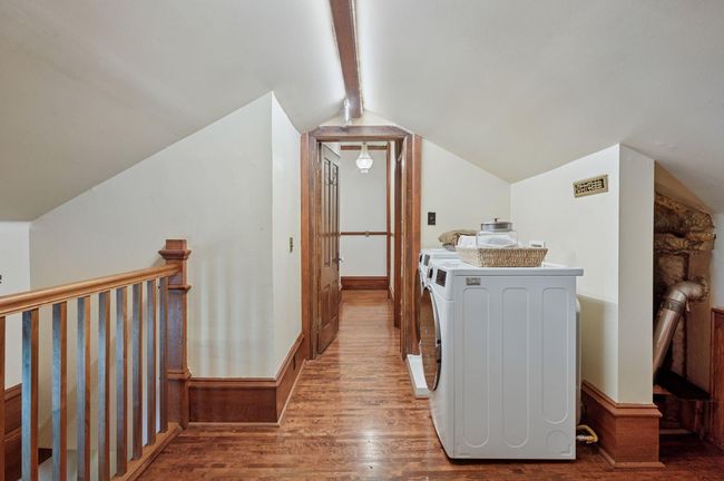 Upper level laundry with back steps leading to kitchen | Image 38