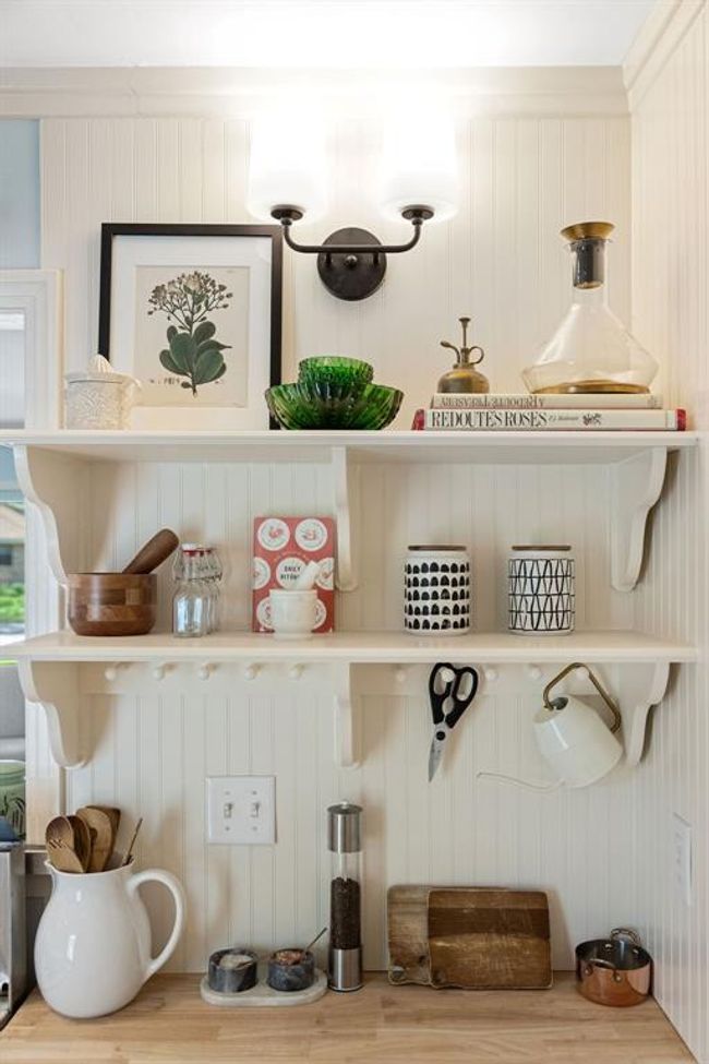 This cottage is feels warm and inviting, yet open and airy at the same time. | Image 13