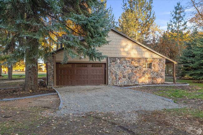 Garage featuring driveway | Image 14