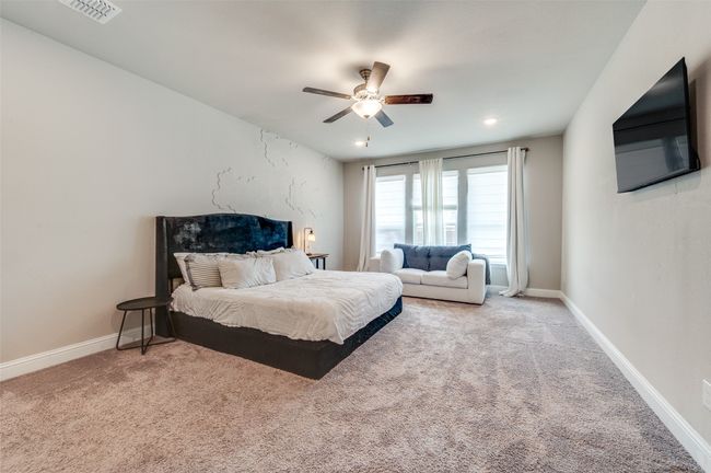 Bedroom featuring visible vents, baseboards, and carpet flooring | Image 27