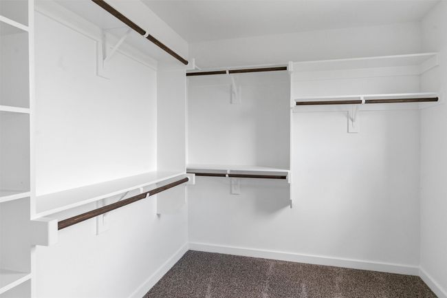 Walk in closet with carpet | Image 28
