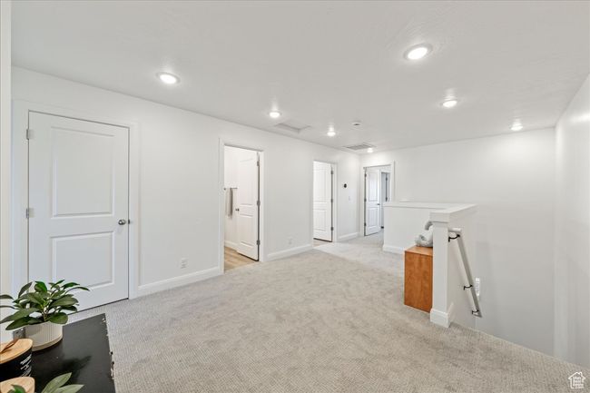 Unfurnished room with light carpet and recessed lighting | Image 15