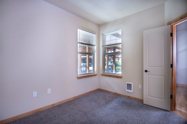 Spare room with heating unit and carpet floors | Image 20