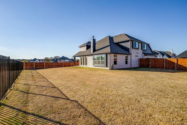 Rear view of property with a lawn | Image 9