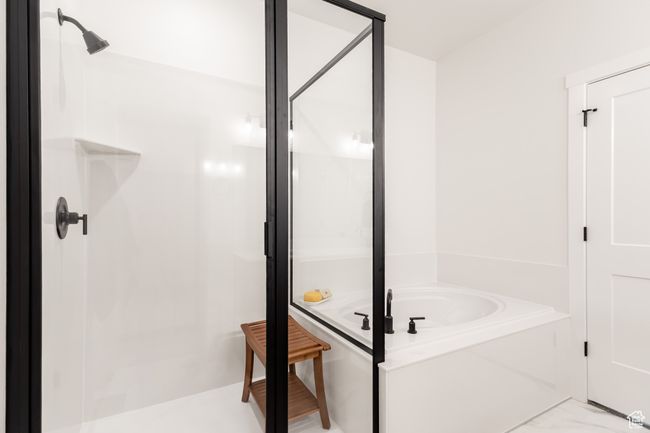 Full bathroom featuring a shower stall and a bath | Image 12