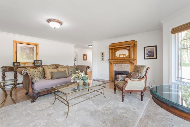 Spacious family room with Travertine flooring, room for a large surround couch. View bay window! | Image 20