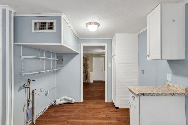 Washroom featuring dark wood finished floors | Image 11