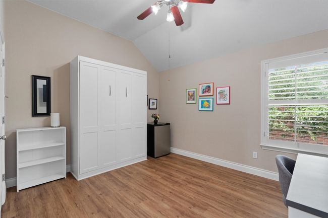 Bedroom featuring a murphy bed that will convey (closed view). | Image 23