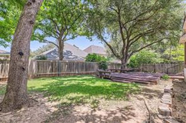 View of fenced backyard | Image 28