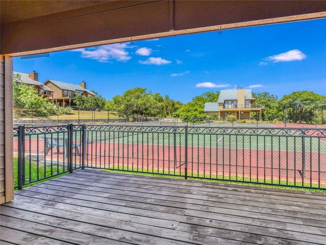Space for your grill under the covered deck is just off the living area. | Image 20