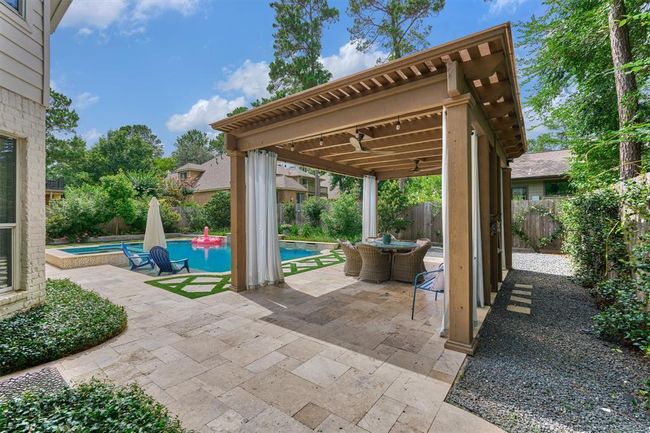 Every detailed covered...Pergola for gathering. Pool for cooling off. Spa for relaxing. Covered seating for conversation. Outdoor kitchen for grilling and entertaining. | Image 37