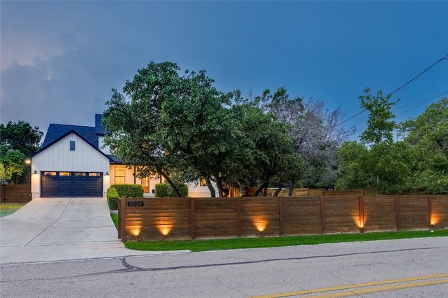 Enjoy your privacy with the remote controlled gate and fence enclosure around the entire property. | Image 6