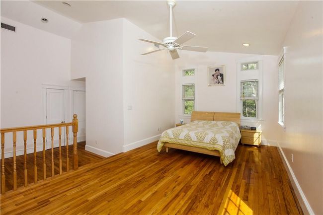 Primary bedroom with vaulted ceiling. | Image 12