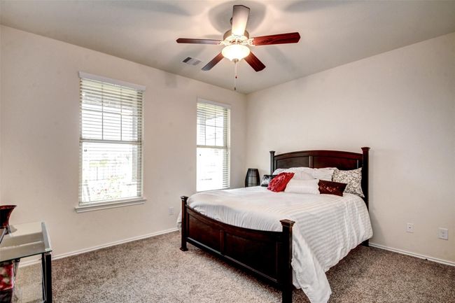 The secondary bedrooms are spacious and bright with generous closet space. | Image 22