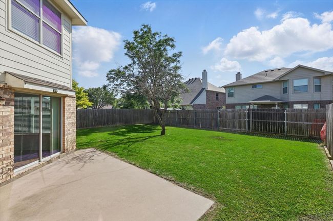 View of yard with a patio and a residential view | Image 28