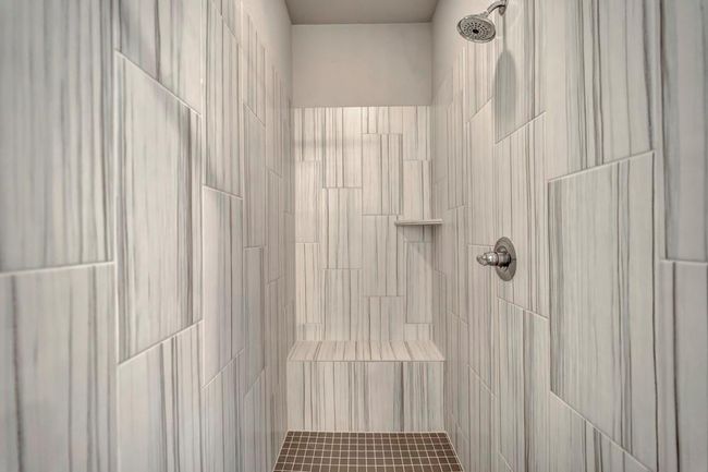 Walk-in shower with bench. | Image 19