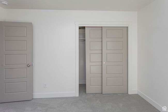 Unfurnished bedroom featuring baseboards, carpet flooring, and a closet | Image 34