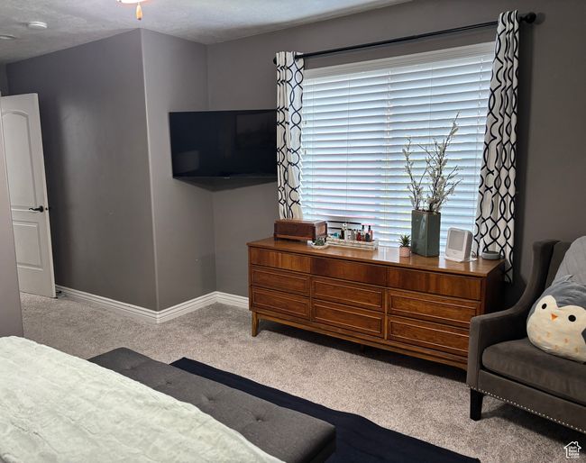 Bedroom with carpet floors and baseboards | Image 5
