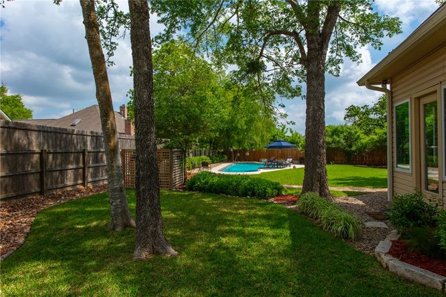 View of yard with a fenced in pool and a fenced​​‌​​​​‌​​‌‌​‌‌​​​‌‌​​‌‌​‌​​​​​‌ backyard | Image 40