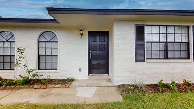 1905 County Rd 235, Alvin, TX Front door entrance and black wooden door. | Image 2