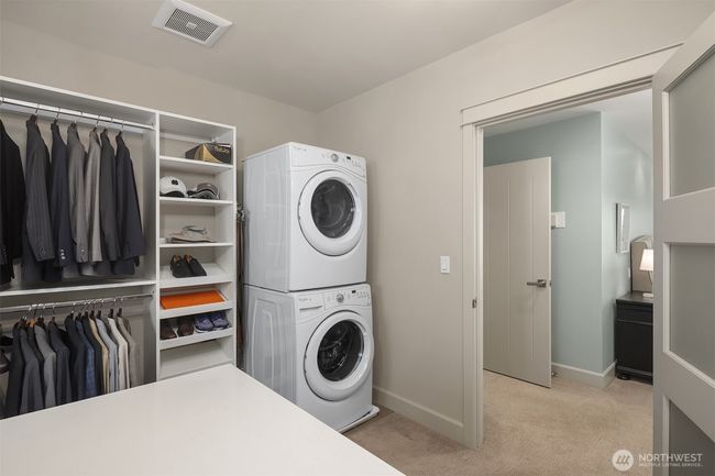 Spacious primary closet with dedicated washer and dryer. | Image 25