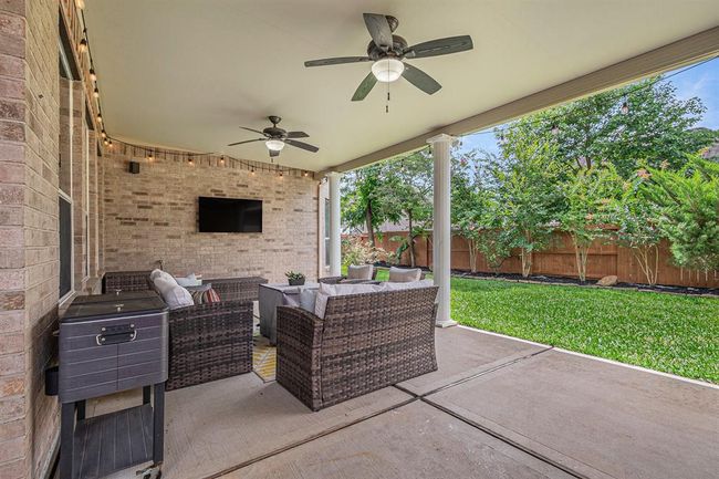 Step outside on to the expanded covered patio, sit under a breezy fan and watch the big game! | Image 36