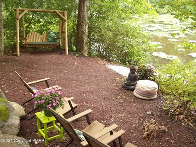 private sitting are on lake shore | Image 3