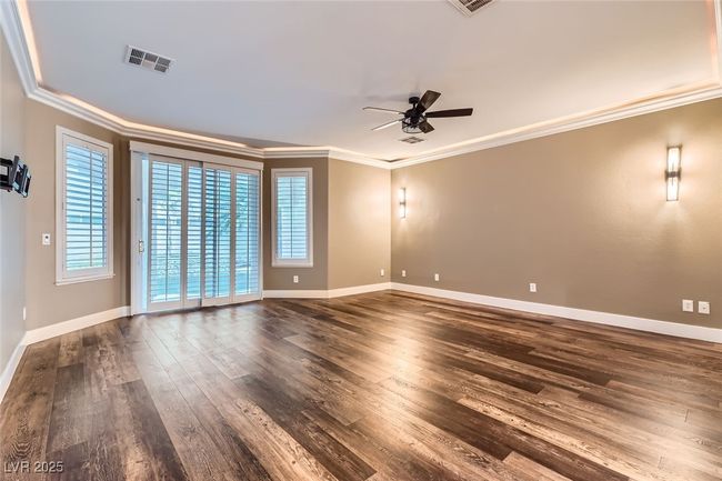 Unfurnished room with ornamental molding, ceiling fan, and dark wood-style floors | Image 18