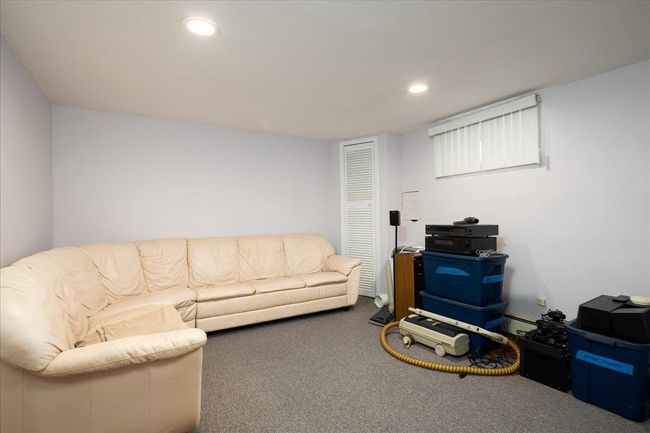 Living room featuring carpet floors, recessed lighting, and a baseboard radiator | Image 28